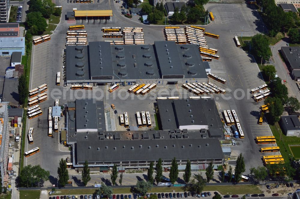 Aerial photograph Warschau - Busses at the bus garage in the Mokotow District in Warsaw in Poland. The garage with its workshops, halls and parking lots is located on Jana Pawla Woronicza street. Several busses of the public transportation are parked here