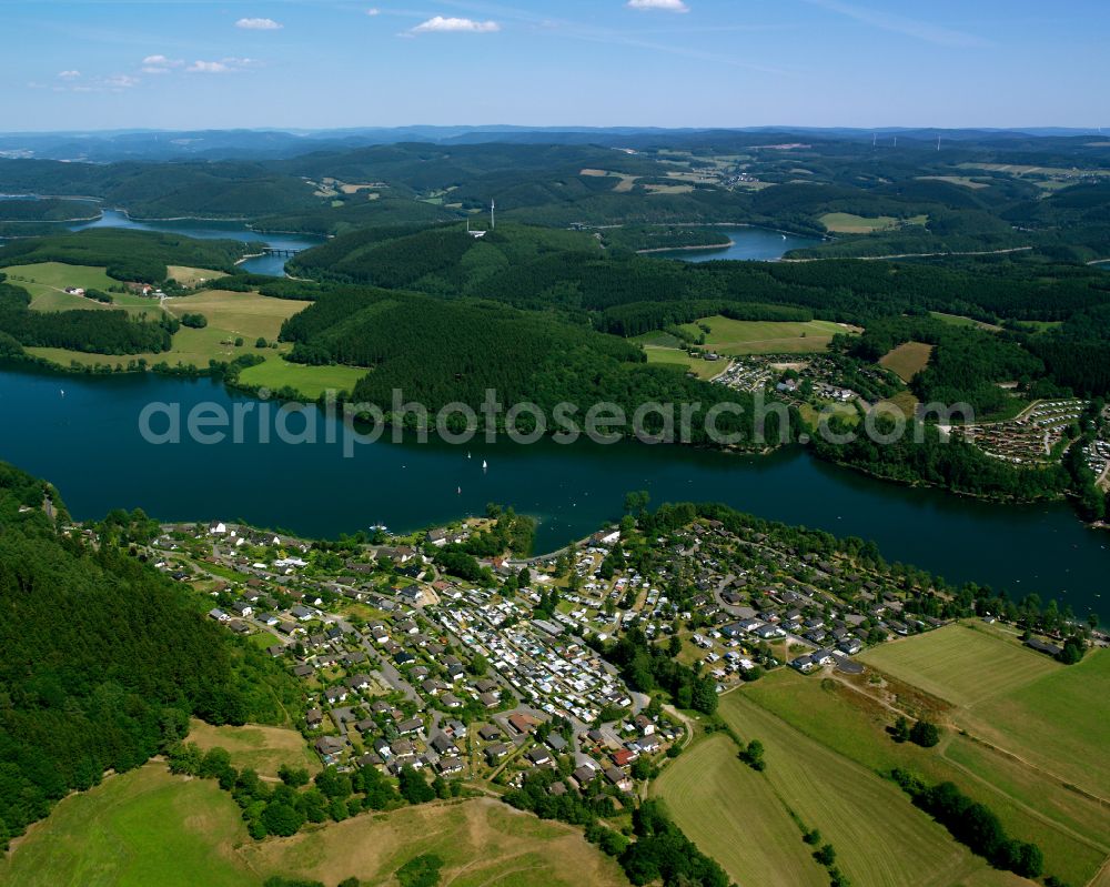 Wörmge from above - Campsite Camping Gut Kalberschnacke with caravans and tents on the lake shore of Lister in Woermge in the state North Rhine-Westphalia, Germany