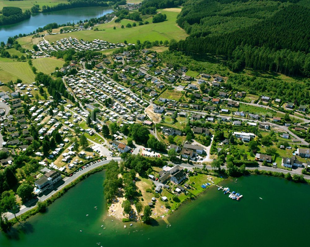 Wörmge from the bird's eye view: Campsite Camping Gut Kalberschnacke with caravans and tents on the lake shore of Lister in Woermge in the state North Rhine-Westphalia, Germany