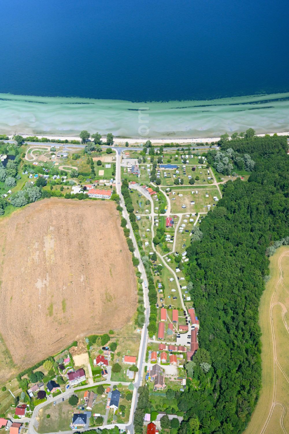 Niendorf from above - Campsite with caravans and tents in the coastal area Campingplatz Ostseequelle on street Strandstrasse in Niendorf at the baltic sea coast in the state Mecklenburg - Western Pomerania, Germany