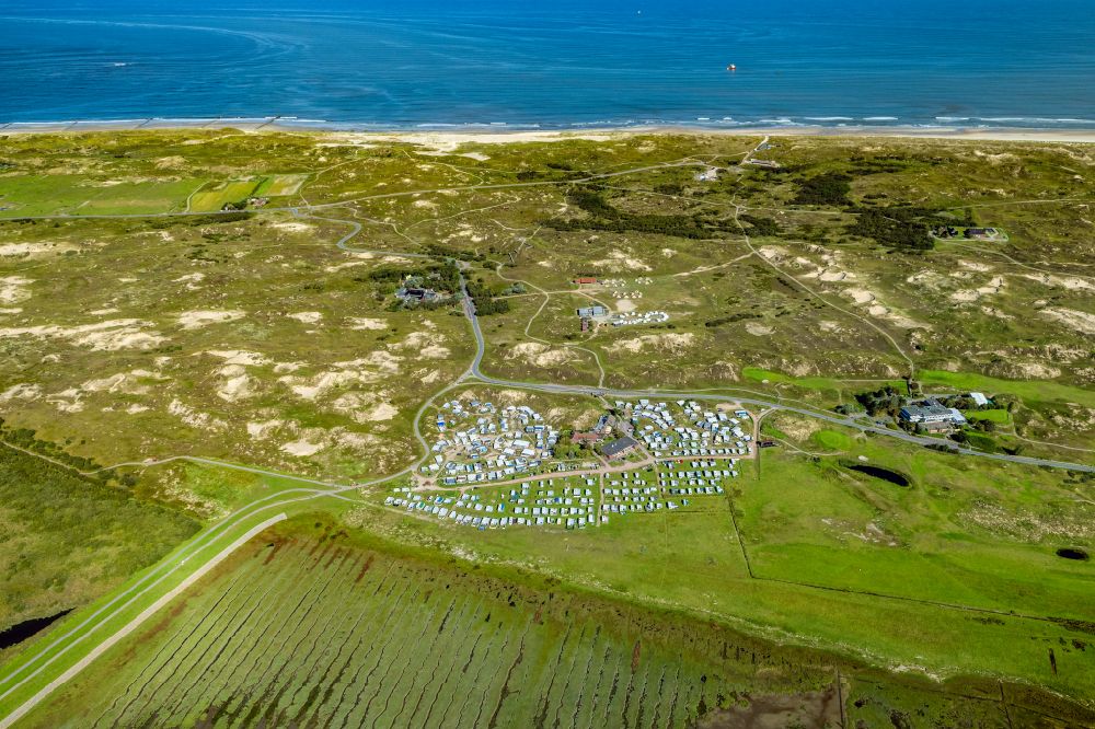 Norderney from the bird's eye view: Campsite with caravans and tents in the coastal area Um Ost in Norderney in the state Lower Saxony, Germany