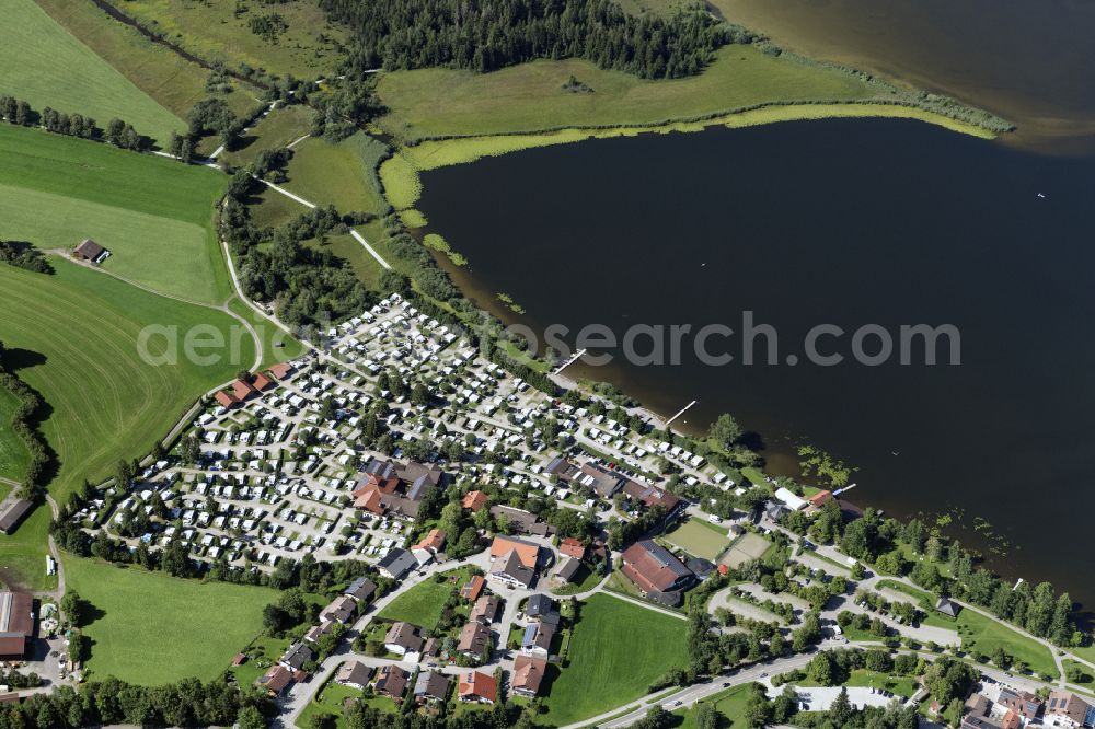 Füssen from the bird's eye view: Campsite with caravans and tents on the lake shore of Hopfensee on street Fischerbichl in Fuessen in the state Bavaria, Germany