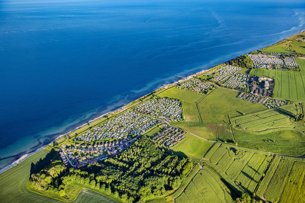 Aerial image Heringsdorf - Campsite with caravans and tents on the lake shore Suessau in Heringsdorf in the state Schleswig-Holstein, Germany