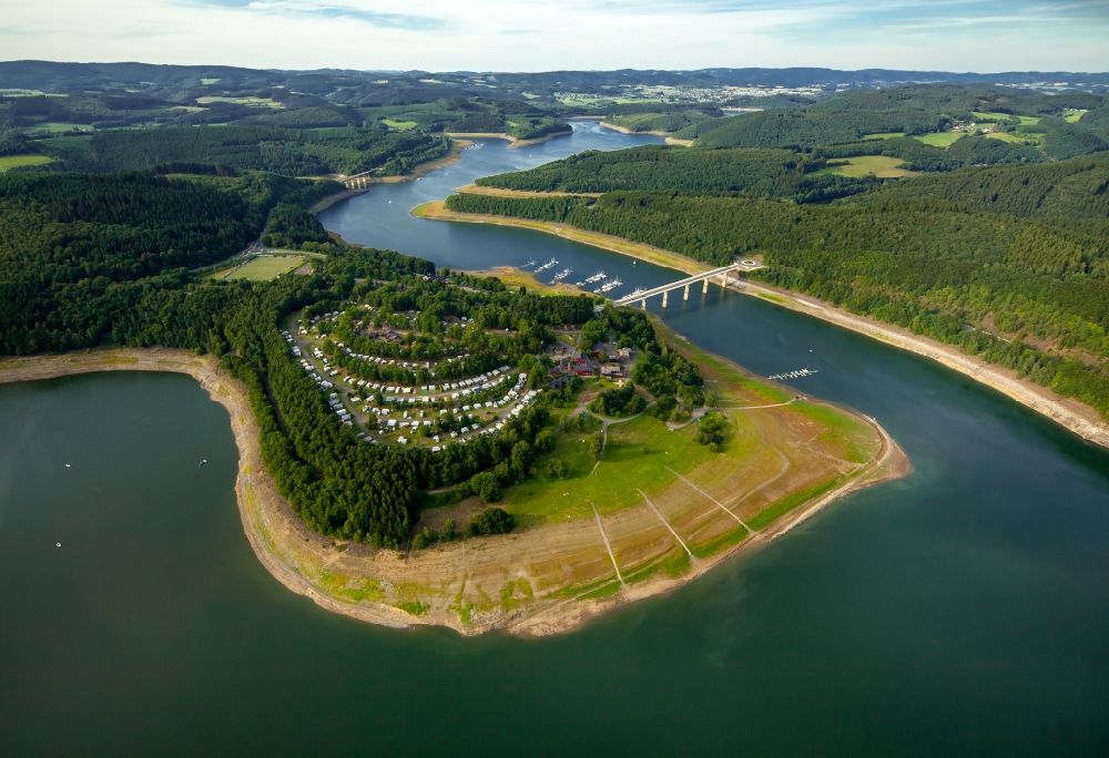 Aerial image Olpe - Camp site Campingplatz Biggesee GmbH with caravans and tents at the Bigge with low water stand in Olpe in the state North Rhine-Westphalia