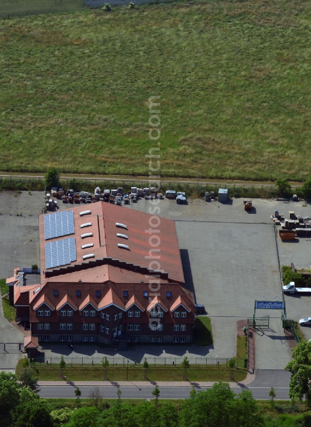 Aerial image Wegendorf - View of the facility of CITY-HAUS Bauhof Wegendorf in the Alte Dorfstrasse in Wegendorf. In addition to that the MBUTT Service-und Handelsgesellschaft mbH has its domicile there