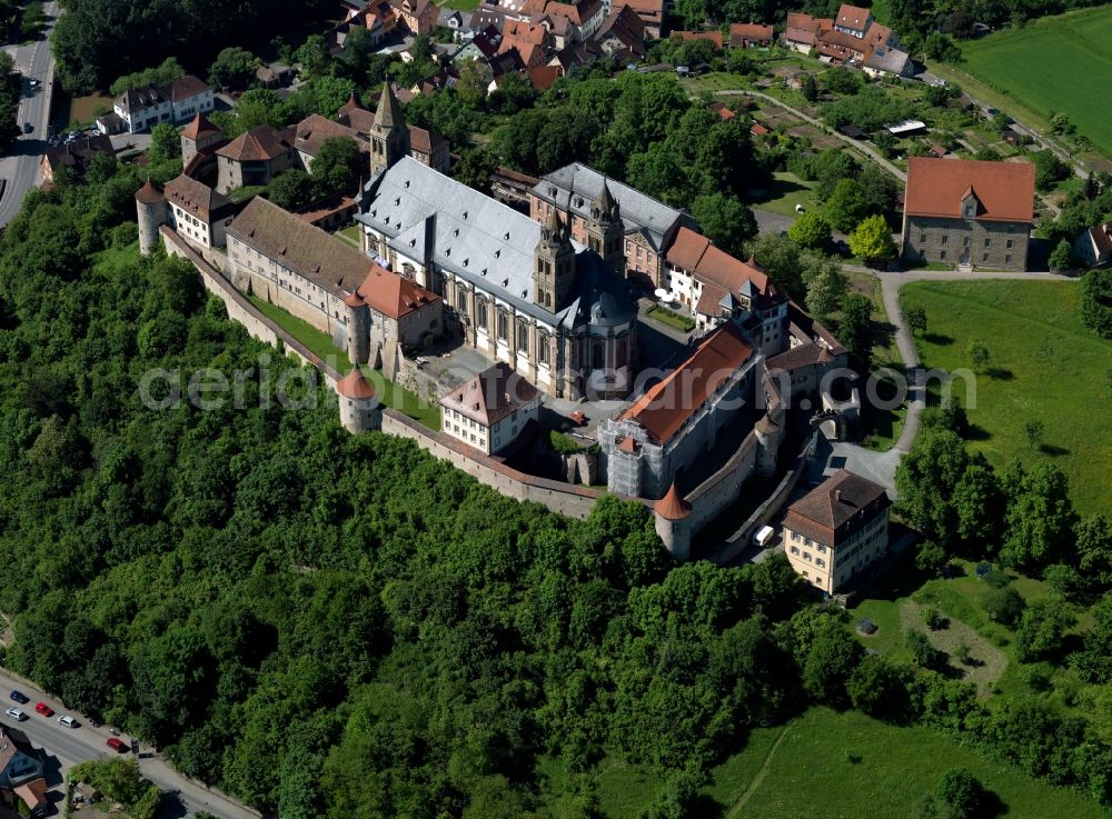 Aerial image Schwäbisch Hall - Comburg (Groszcomburg) in Schwaebisch Hall in the state of Baden-Wuerttemberg. The former Benedictinian monastery is located on an old rock island of the river Kocher in the Steinbach part of the town. The former castle was converted to a monastery in 1078. It is surrounded by a ring wall with watchtowers from the 16th century and includes a Romanic cloister and three churches of which the collegiate church Saint Nikolaus is the largest. It is a landmark of the region with its twin towers