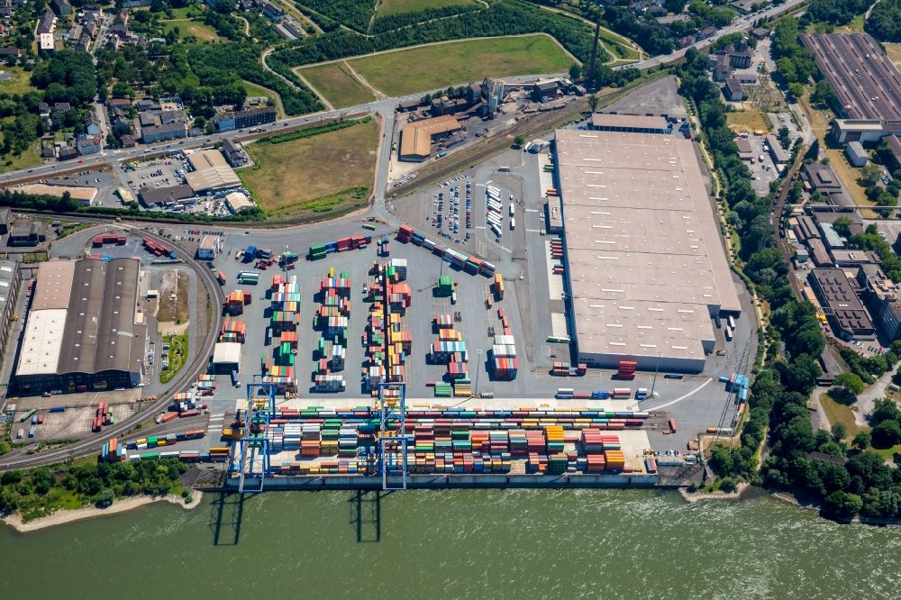Duisburg from the bird's eye view: Building complex and grounds of DIT Duisburg Intermodal Terminal in the logistics center logport on the left riverbank of the Rhine in Duisburg in the state of North Rhine-Westphalia. The center is part of the harbour duisport and located in the Rheinhausen part of Duisburg