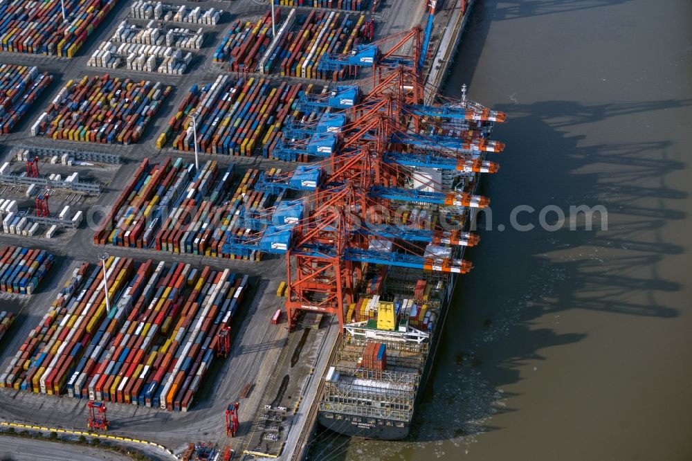 Aerial image Hamburg - Container Terminal Burchardkai Unlanding of 3 container cranes from a transport ship in Hamburg, Germany
