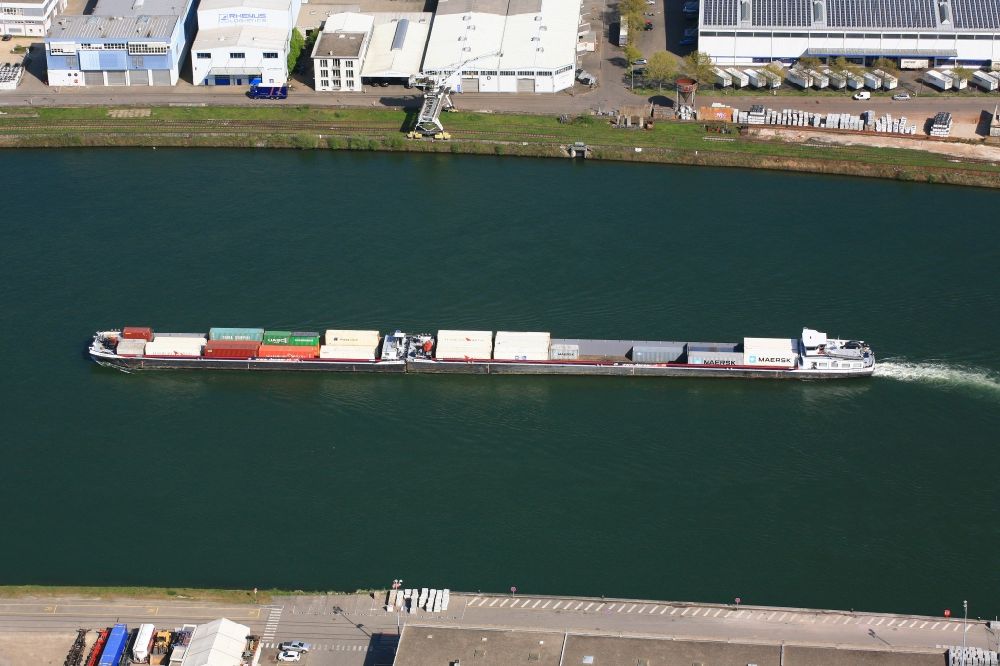 Weil am Rhein from the bird's eye view: Cargo ship and container carriers on the inland shipping waterway of the river course of the Rhine river in Weil am Rhein in the state Baden-Wuerttemberg, Germany