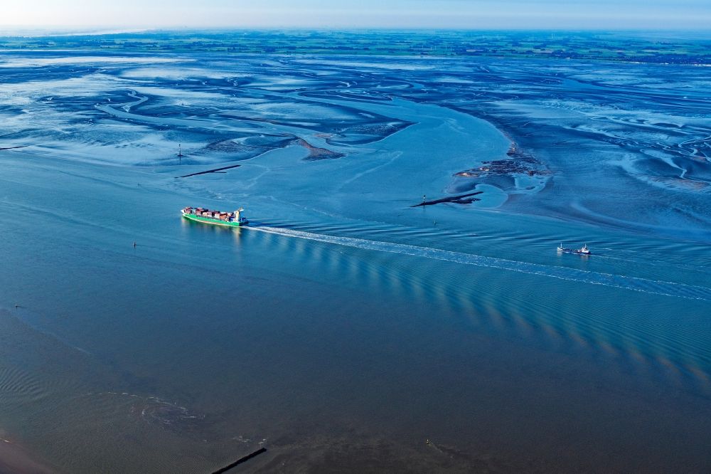 Aerial image Wurster Nordseeküste - Container ship on the Outer Weser in the Wadden Sea in Wurster North Sea Coast in the state Lower Saxony, Germany