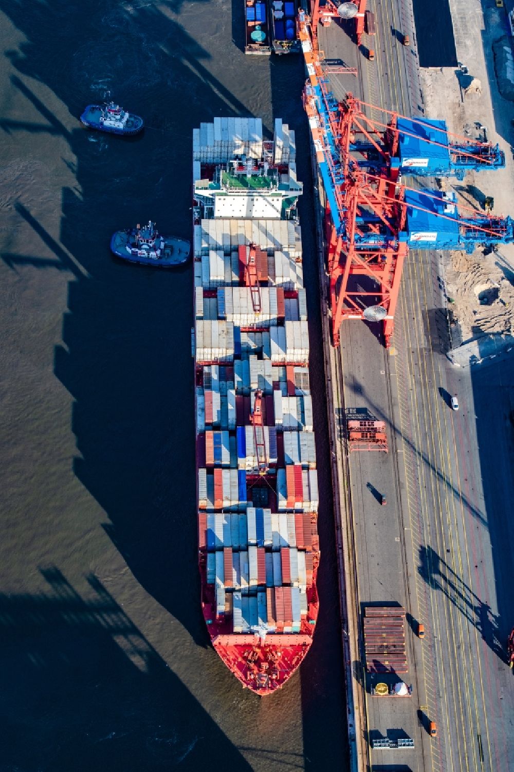Hamburg from the bird's eye view: Container ship Texas Triumph at Burchardkai in the harbor in the district Waltershof in Hamburg, Germany