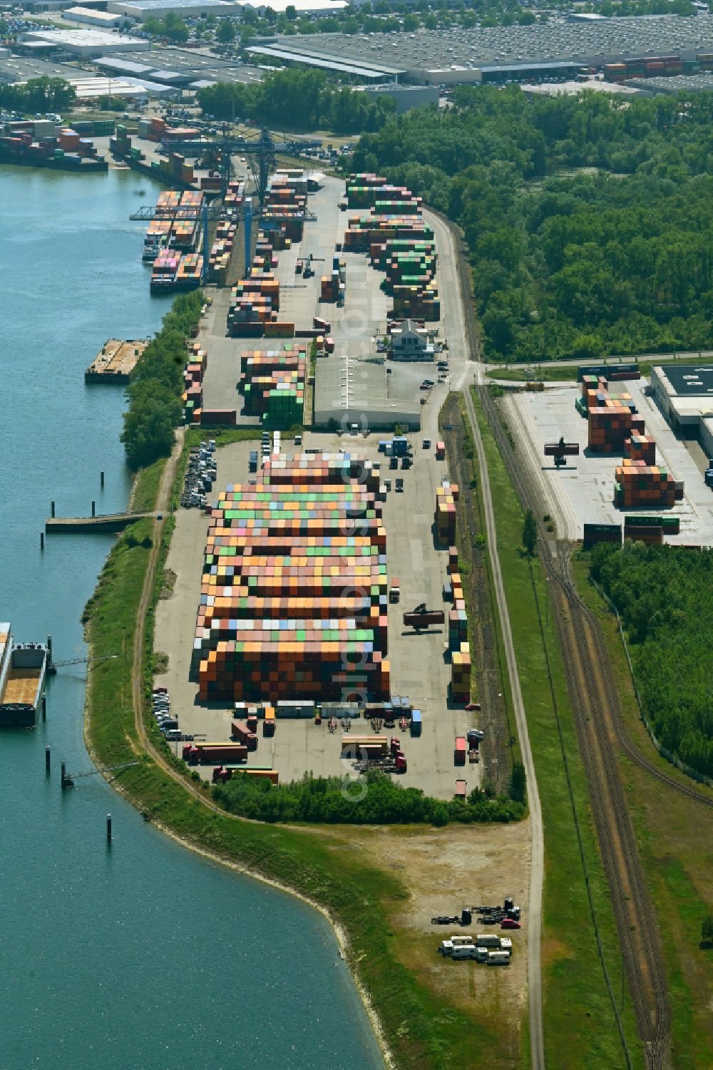 Wörth am Rhein from the bird's eye view: Container terminal in the container port of Contargo Woerth-Karlsruhe GmbH on the lake of the Landeshafen in the district Industriegebiet Woerth-Oberwald in Woerth am Rhein in the state Rhineland-Palatinate, Germany