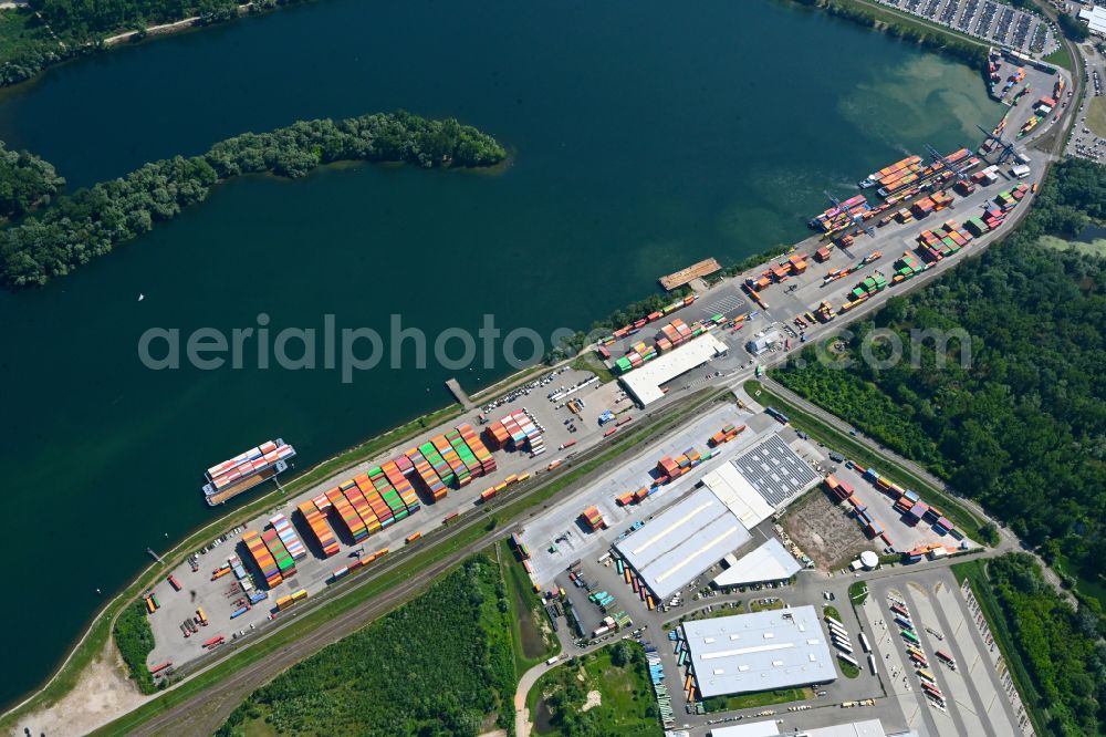 Wörth am Rhein from above - Container terminal in the container port of Contargo Woerth-Karlsruhe GmbH on the lake of the Landeshafen in the district Industriegebiet Woerth-Oberwald in Woerth am Rhein in the state Rhineland-Palatinate, Germany