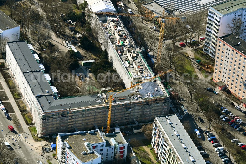 Aerial photograph Berlin - Construction site for the renovation and modernization of the buildings in the residential area Genslerstrasse - Liebenwalder Strasse - Heiligenstadter Strasse in the district Hohenschoenhausen in Berlin, Germany