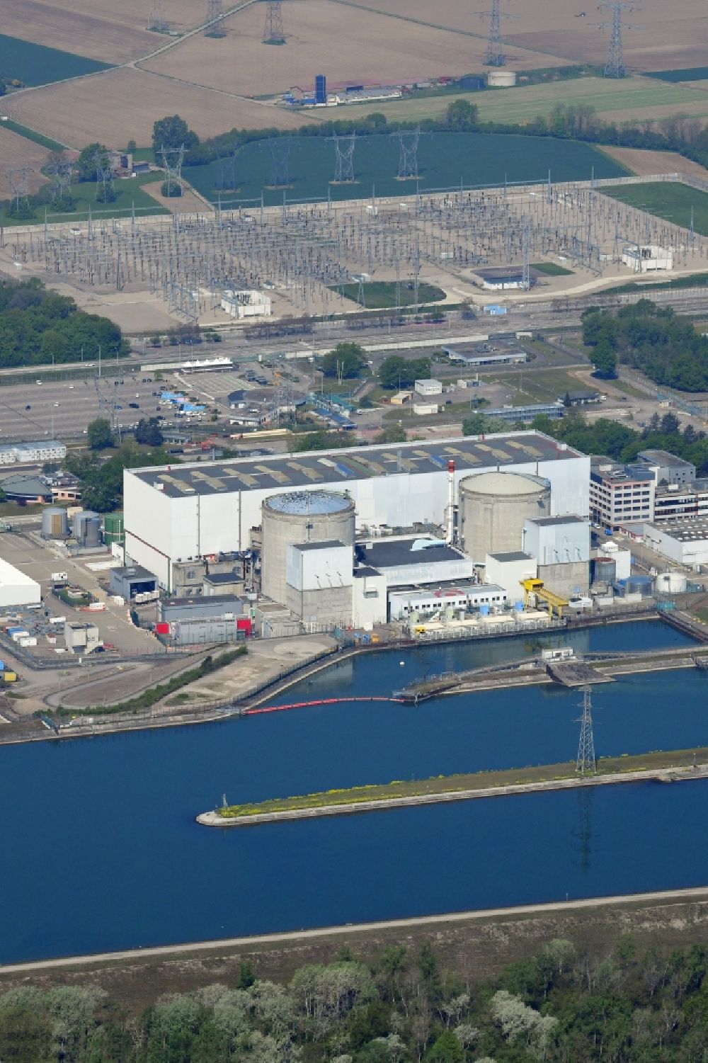 Aerial image Fessenheim - The nuclear power plant in Fessenheim in France on the Upper Rhine on the shore of the Grand Canal d'Alsace is the oldest nuclear power plant in France