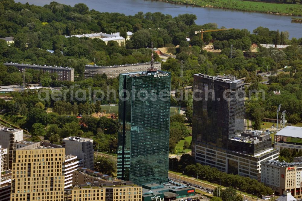 Aerial image Warschau - The Intraco I tower in the district of Zoliborz in Warsaw in Poland. The elaborate building with its green glas facade was built in the 1970s. It is officially called Tower Building of the Centre for Foreign Commerce. In front of its entrance there is a roundabout with a memorial. The building is 107m high and has 39 floors. Owner is the PHN Polski Holding Nieruchomo?ci S.A., therefore it is owned by the state of Poland