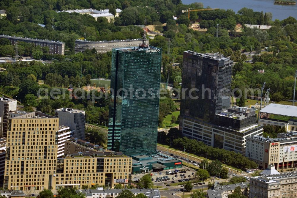 Aerial photograph Warschau - The Intraco I tower in the district of Zoliborz in Warsaw in Poland. The elaborate building with its green glas facade was built in the 1970s. It is officially called Tower Building of the Centre for Foreign Commerce. In front of its entrance there is a roundabout with a memorial. The building is 107m high and has 39 floors. Owner is the PHN Polski Holding Nieruchomo?ci S.A., therefore it is owned by the state of Poland