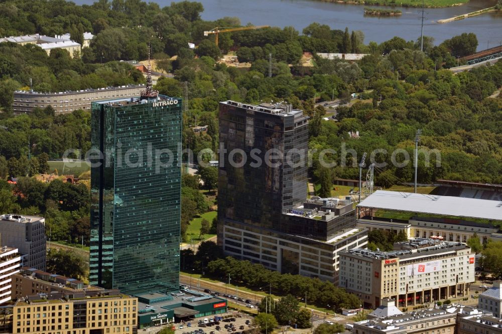 Warschau from above - The Intraco I tower in the district of Zoliborz in Warsaw in Poland. The elaborate building with its green glas facade was built in the 1970s. It is officially called Tower Building of the Centre for Foreign Commerce. In front of its entrance there is a roundabout with a memorial. The building is 107m high and has 39 floors. Owner is the PHN Polski Holding Nieruchomo?ci S.A., therefore it is owned by the state of Poland