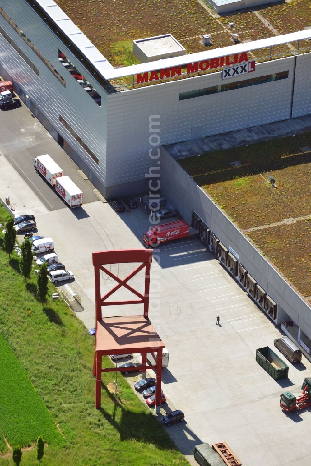 Aerial photograph Eschborn - The Mann Mobilia XXXL furniture store in Eschborn in the metropolitan area of Frankfurt am Main in the state of Hessen. View of the red chair, the trade mark of the XXXL furniture store chain
