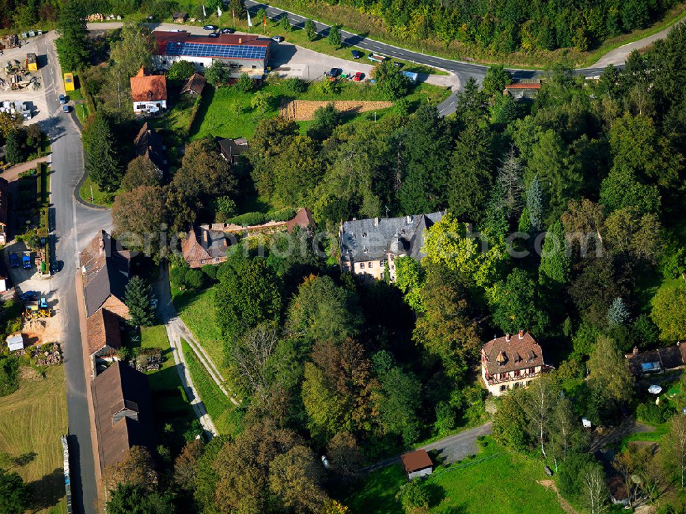 Burgsinn from the bird's eye view: The New Castle in Burgsinn in the state of Bavaria. Burgsinn is a former market in Lower Franconia. The castle was built in the Renaissance style and is located on the edge of a forest
