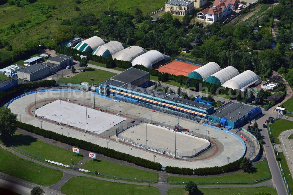 Warschau from above - Stegny sports facilities in the Mokotow District in Warsaw in Poland. The facilities include a large, oval ice rink and an ice hockey field. In summer, tennis courts, halls and track and field facilities can be used. The compound is located in the East of the district on the motorway A2