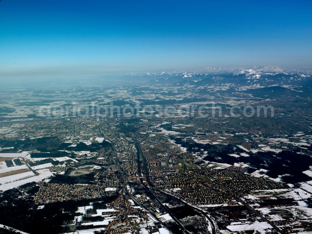 Aerial photograph Rosenheim - The snowed in and frozen city of Rosenheim in the free state of Bavaria. Overview and landscape of the city and its surrounding environment. Visible in the background are mountains and peaks of the alps. Rosenheim is the thirdlargest city in the region of Oberbayern and is located on the shores of the river Inn