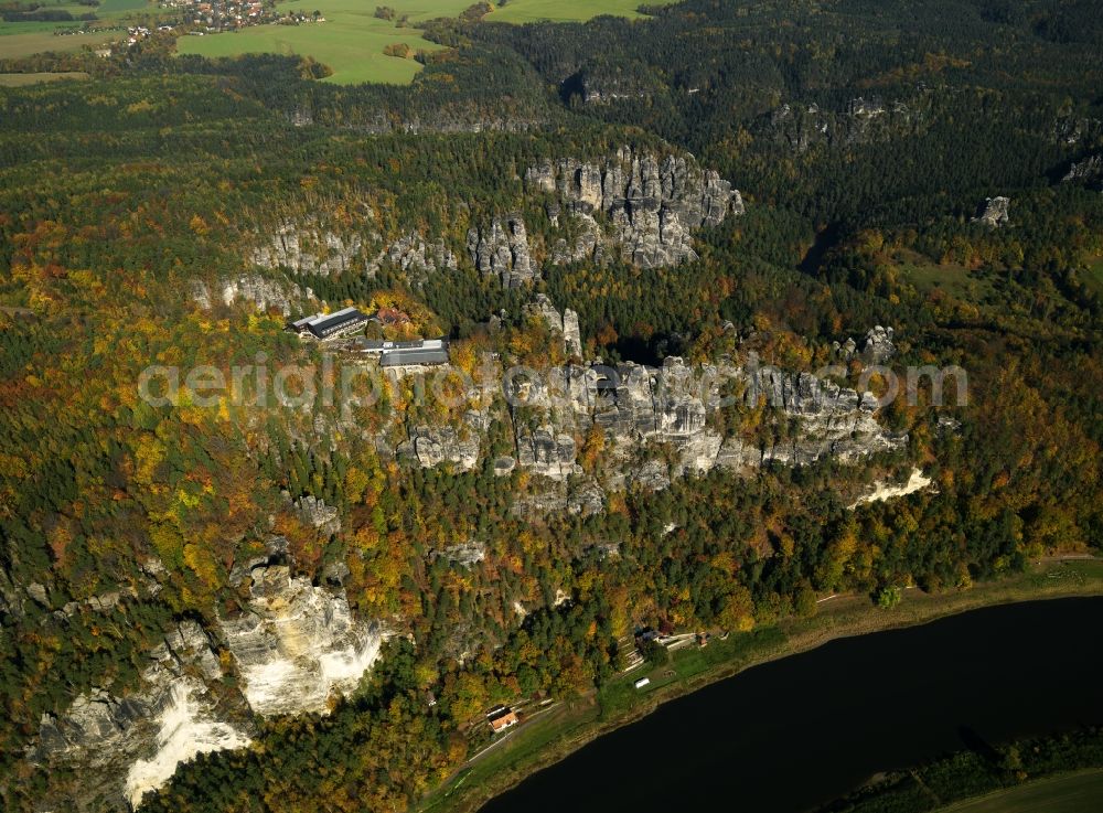 Stadt Wehlen from the bird's eye view: The tower is a rock formation with a viewing platform in the Saxon Switzerland on the right bank of the Elbe between the city and Rathen Wehlen. It is one of the most visited tourist attractions in the Saxon Switzerland. From the bastion falls from the narrow rocky reef about 194 meters steeply to the river Elbe. It offers a wide view over the Elbe and the Elbe Sandstone Mountains