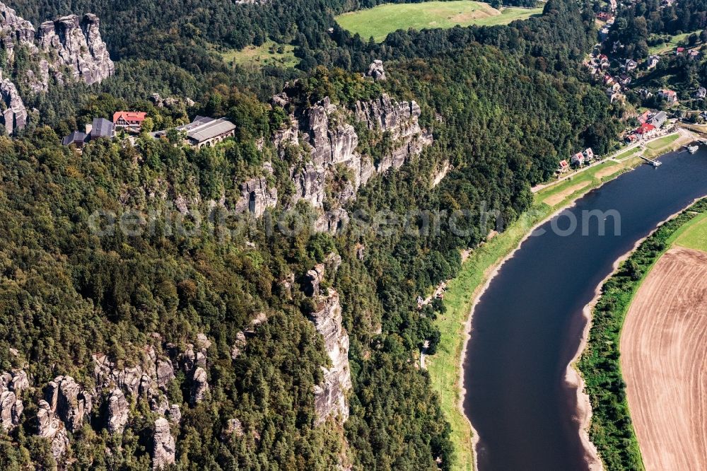 Aerial image Rathen - The tower is a rock formation with a viewing platform in the Saxon Switzerland on the right bank of the Elbe between the city and Rathen Wehlen. It is one of the most visited tourist attractions in the Saxon Switzerland. From the bastion falls from the narrow rocky reef about 194 meters steeply to the river Elbe. It offers a wide view over the Elbe and the Elbe Sandstone Mountains