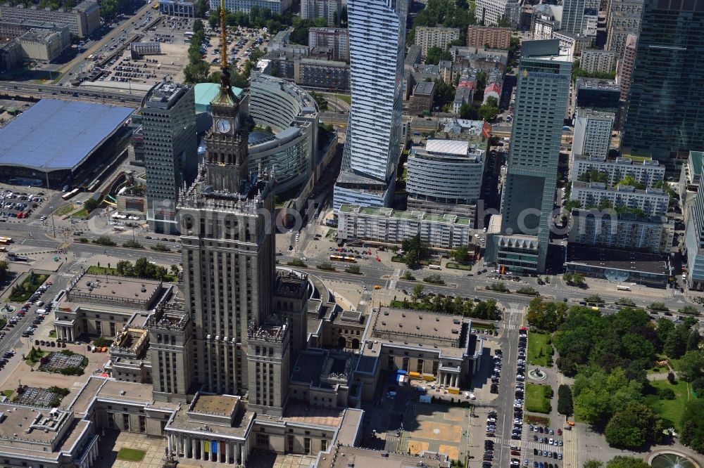 Warschau from above - The high-rise building complex of the Palace of Culture and Science (Palac Kultury i Nauki Polish) in downtown Warsaw in Poland. The building and landmark of the city was a gift by the former Soviet Union. It was designed by the architect Lew Rudnew in a socialist classicist style. It is the highest building in Poland and is surrounded by new high rise buildings and towers. Its top is used as an antenna and broadcasting tower for radio, TV and several mobile network operators