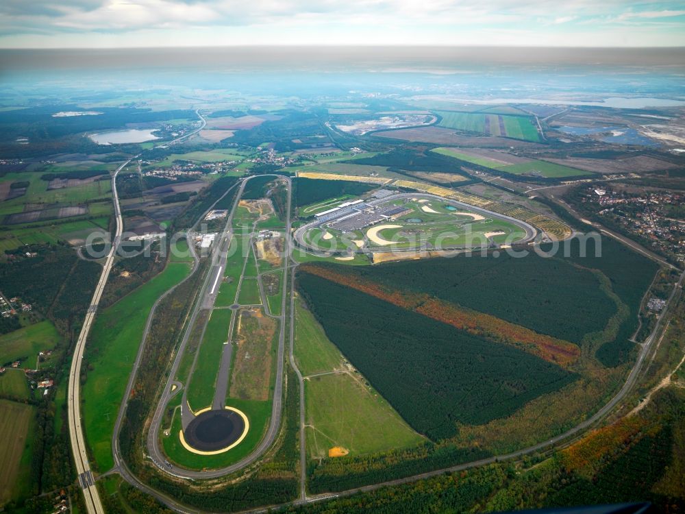 Aerial image Klettwitz - The Lausitzring in Klettwitz in the district of Oberspreewald-Lausitz in the state of Brandenburg. It is officially called EuroSpeedway Lausitz and is a permanent race track with a unique Superspeedway. The facilities include several race tracks and variations, including a Grand Prix track for car and motorbikes, but als safe driving test tracks. Apart from race events like the ADAC-Masters-Weekend and races of the DTM and the Porsche Cups, there are also events for inline skaters and cycling