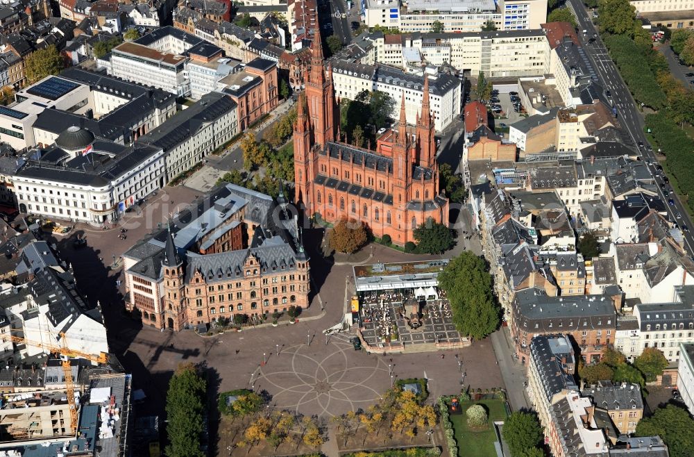 Wiesbaden from above - The market square of the city of Wiesbaden in the state of Hessen. The market square is in the foreground. The red Market Church with its five towers is neighbouring the Schloßplatz square. Adjacent to it is the city hall of Wiesbaden (with its triangle shape) and the city palace which is the seat of the state parliament of Hessen