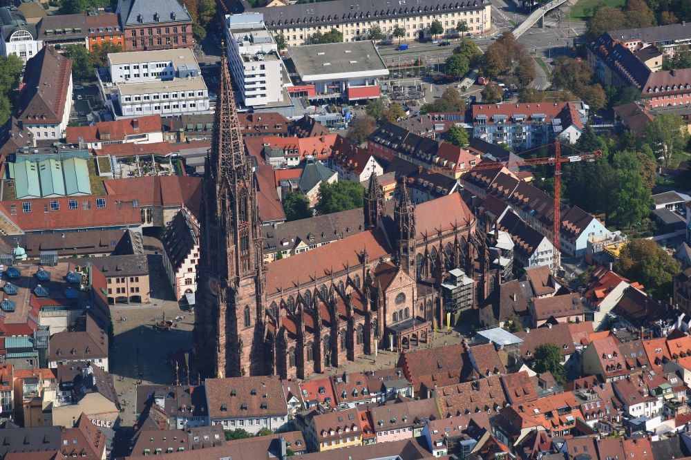 Freiburg im Breisgau from above - Church building Freiburger Muenster in the Old Town- center of downtown Freiburg im Breisgau in the state Baden-Wurttemberg, Germany. The steeple, after years of renovation, can now be seen without scaffold