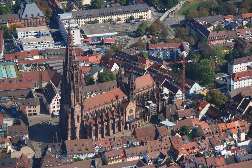 Aerial image Freiburg im Breisgau - Church building Freiburger Muenster in the Old Town- center of downtown Freiburg im Breisgau in the state Baden-Wurttemberg, Germany. The steeple, after years of renovation, can now be seen without scaffold