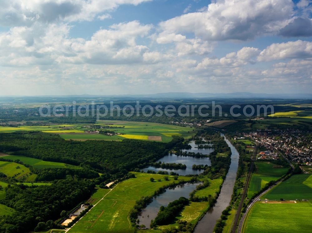 Schonungen from the bird's eye view: The run of the river Main in the borough of Schonungen in the state of Bavaria. The landscape is characterised by the waters and shores of the river with its sidearms and ponds. On the riverbank, there are several hills with vineyards