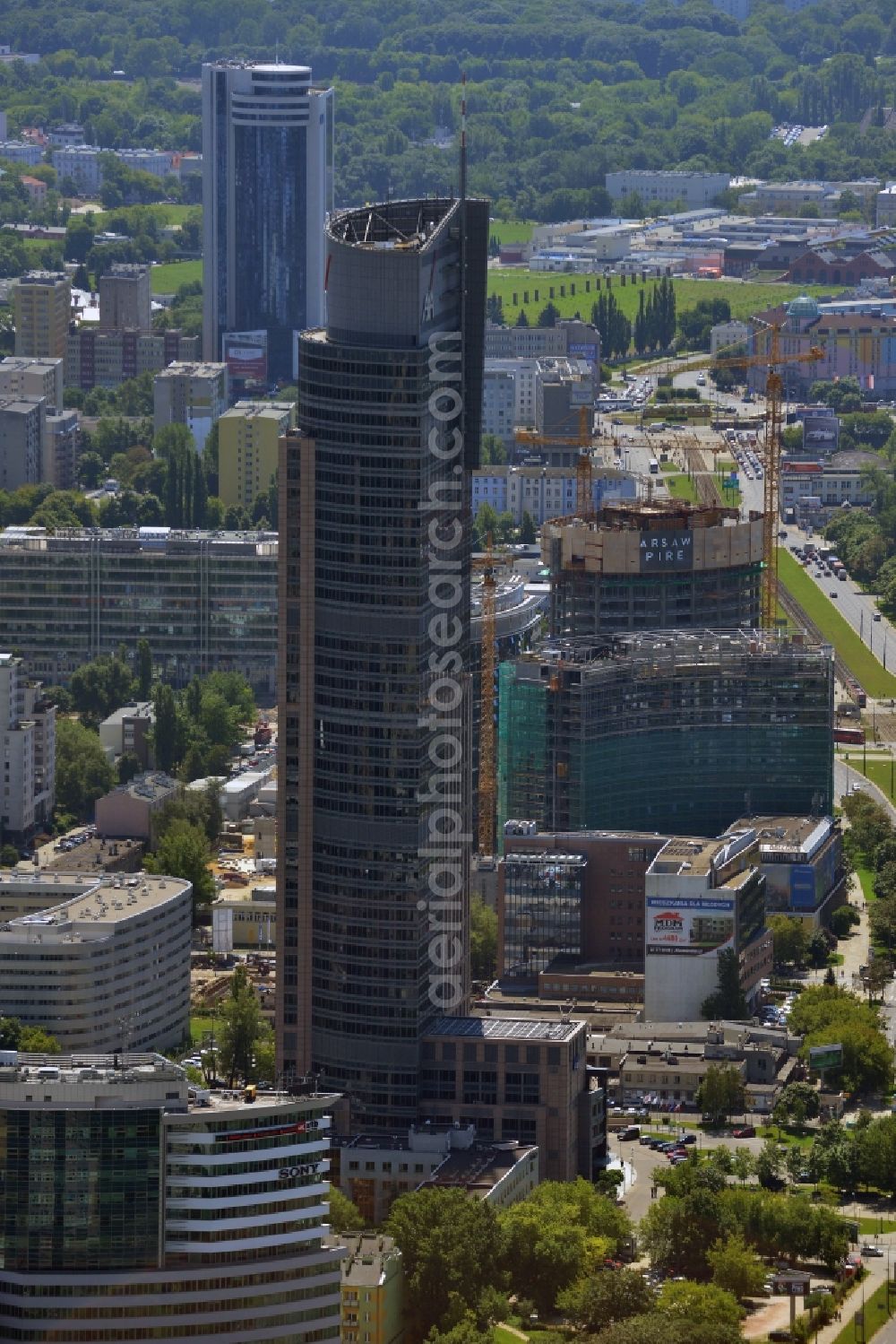 Aerial photograph Warschau - Warsaw Trade Tower in the Wola district of Warsaw in Poland. The skyscraper is an office building whose primary tenant is the insurance company AXA. Its logo is very well visible on the upper floors. The tower is over 200m high and has Europe's fastest elevator. It was completed in 1999 after two years of construction and is the second tallest building in Warsaw