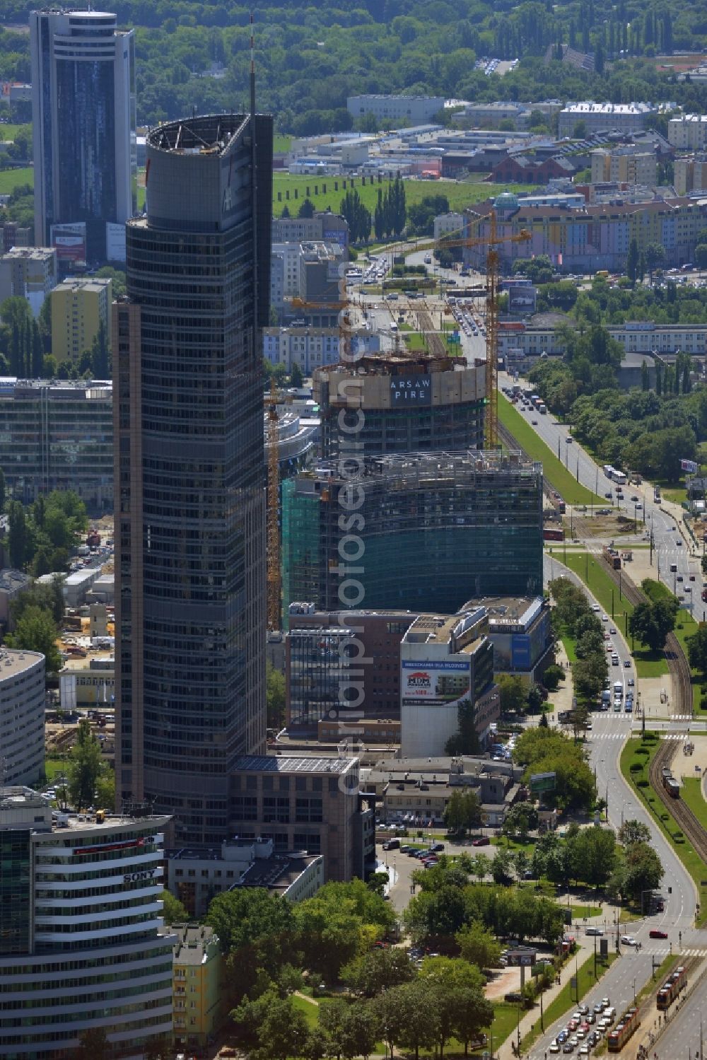 Warschau from above - Warsaw Trade Tower in the Wola district of Warsaw in Poland. The skyscraper is an office building whose primary tenant is the insurance company AXA. Its logo is very well visible on the upper floors. The tower is over 200m high and has Europe's fastest elevator. It was completed in 1999 after two years of construction and is the second tallest building in Warsaw