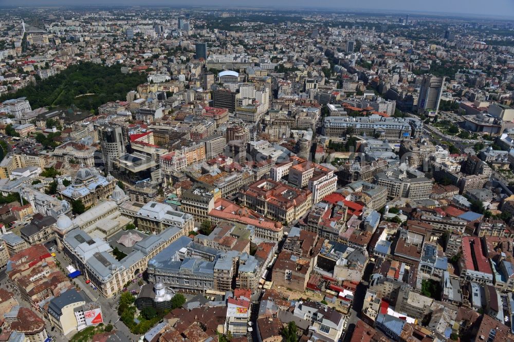 Bukarest from above - The Old Town of Bucharest and the buildings of the Romanian National Bank in the romanian capital of Bucharest. The overview shows the Old Town, also called District Lipscani, in Sector 3. Central in the image are the buildings of the National Bank. The old building is facing South, was completed in 1890 and is a listed and protected monument. The larger new building is facing North with its facade located on Strada Doamnei. It was built during World War II
