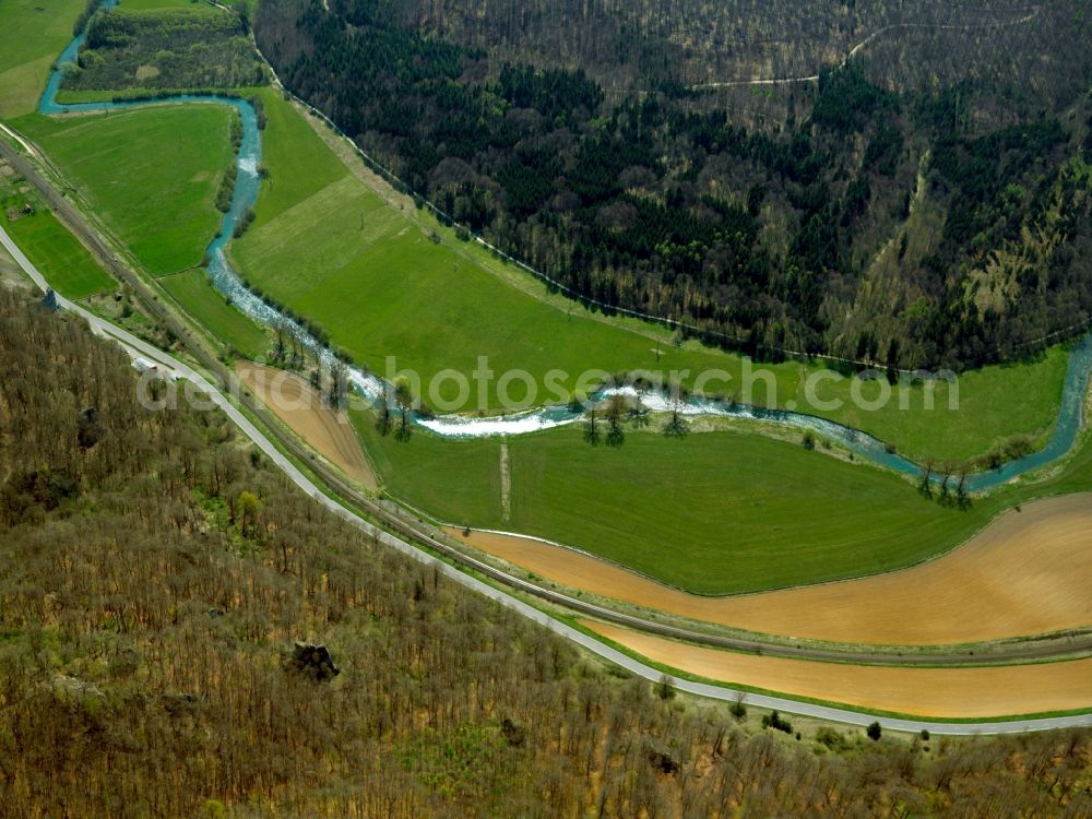 Aerial photograph Blaustein - The river Blau (blue) in the Arnegg part of the county of Blaustein in the state of Baden-Württemberg. The river is a 14,5 km long left sidearm of the Danube. It runs through the area of the district between fields and woods. The valley has some good sports climbing sites and is one of the most interesting climbing areas of the Swabian Alps