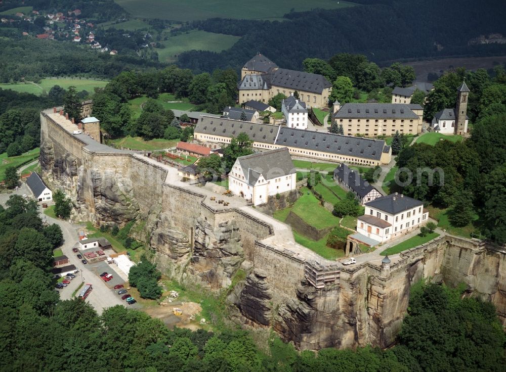 Aerial image Königstein - The Fortress Koenigstein at the river Elbe in the county district of Saxon Switzerland East Erzgebirge in the state of Saxony. The fortress is one of the largest mountain fortresses in Europe and is located amidst the Elbe sand stone mountains on the flat top mountain of the same name