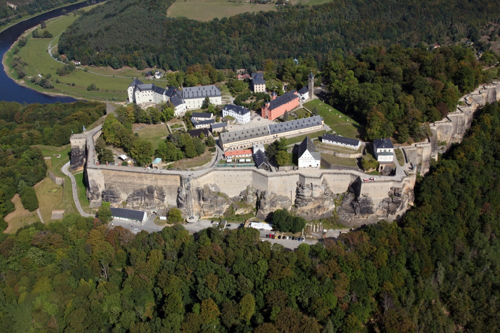 Königstein from above - The Fortress Koenigstein at the river Elbe in the county district of Saxon Switzerland East Erzgebirge in the state of Saxony. The fortress is one of the largest mountain fortresses in Europe and is located amidst the Elbe sand stone mountains on the flat top mountain of the same name