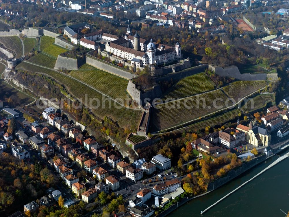 Aerial photograph Würzburg - The fortress Marienberg in the university town of Würzburg in the state of Bavaria. The fortress was built on a hill on the left side of the river Main in 1200. It is one of the landmarks of the town with its three towers, the castle keep and different bastions and gates