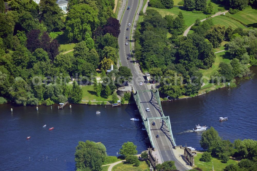 Aerial image Potsdam - The Glienicker Bridge in Potsdam in the state of Brandenburg. The bridge connects the Wannsee part of Berlin with the district Berliner Vorstadt of Potsdam across the river Havel. The frame bridge became famous during the Cold War under the nickname Bridge of Spies due to several deals and exchanges of people between West and East Germany and the powers of the Cold War
