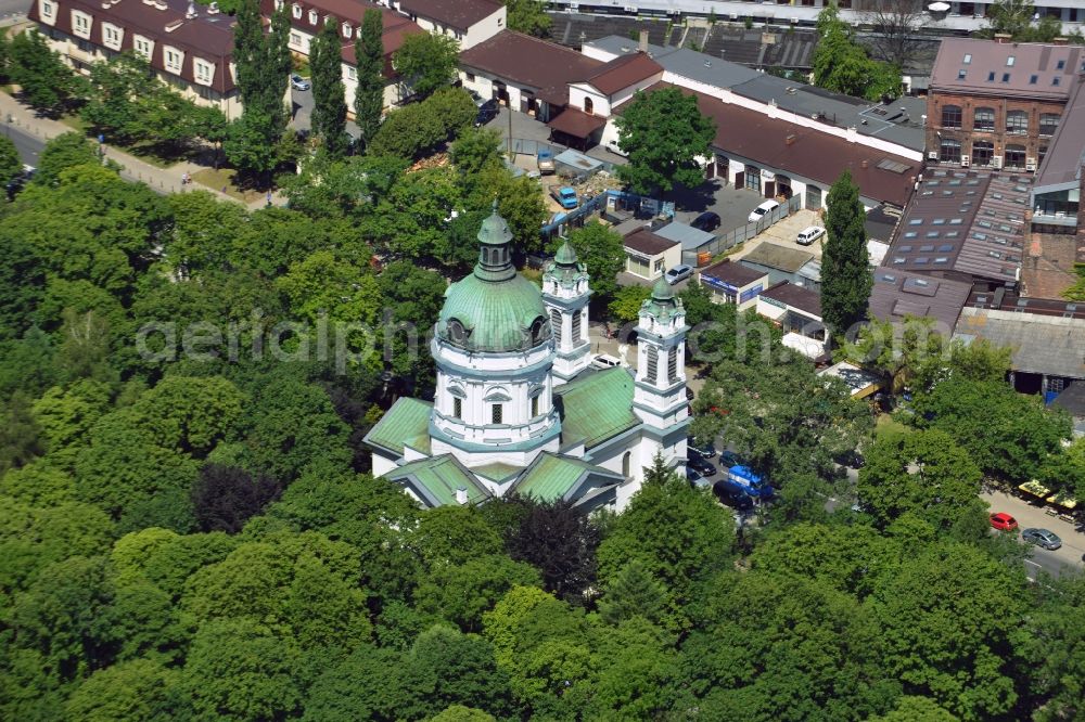 Aerial image Warschau - The Saint Charles Borromäus Church in the Powazki district of Warsaw in Poland. The church (Ko?ció? pw ?wi?tego Karola Boromeusza) was built in th 18th century and refurbished in the 19th century. During the Warsaw Resistance, it was destroyed. It was renovated in 1960 and with its dome and two towers rebuilt. The church is located on the compound of the Powazki cemetery, surrounded by forest and opposite a residential area