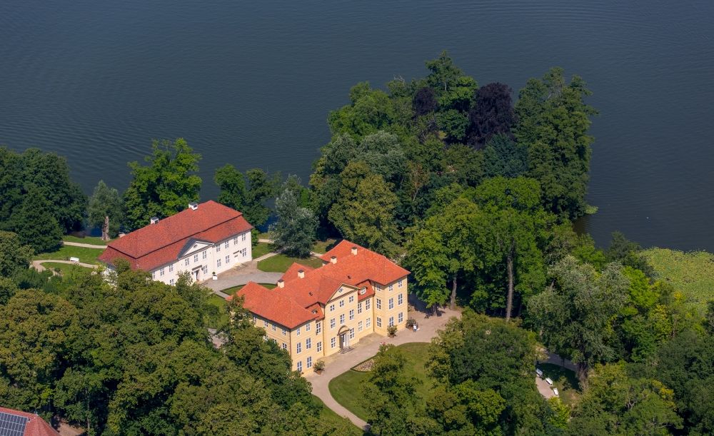 Aerial image Mirow - The Mirow Castle island with its ensemble of buildings of the castle Mirow, the cavalier house and the St. John church on Lake Mirow in Mirow in Mecklenburg-Vorpommern