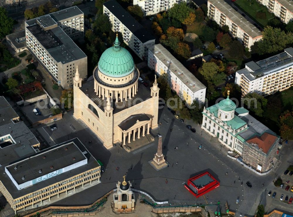 Potsdam from the bird's eye view: The St. Nicholas Church is an evangelical church in the Old Market in Potsdam. The building in classical style was designed by Karl Friedrich Schinkel in 1830 to 1837. The drum dome was built in the period from 1843 to 1850. The construction management took over in 1845 Friedrich Ludwig Persius and August Stiller. Badly damaged towards the end of the Second World War, the St. Nicholas Church consecrated again in 1981 and has since been open to visitors daily