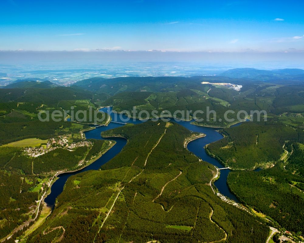 Aerial photograph Harz - The valley lock and the barrier lakes of Oker in the Harz Mountains in the state of Lower Saxony. The lakes are created by the dam of the river Oker. In the summer it is a beloved tourist destination and in winter it is used fo ice swimming. The overview shows the mountains and hills of the Harz Mountains as well as a series of bridges crossing the water