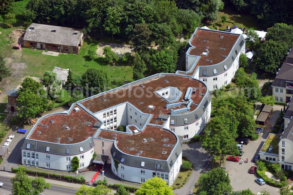 Aerial photograph Vogelsdorf - The residential care facility Katharinenhof in the village of Vogelsdorf in the state of Brandenburg. The facility and compound lies at the Dorfanger at the city limits of Berlin in Fredersdorf. It is a renowned competence center for people suffering from dementia. The inhabitants live in several living groups together at a small forest
