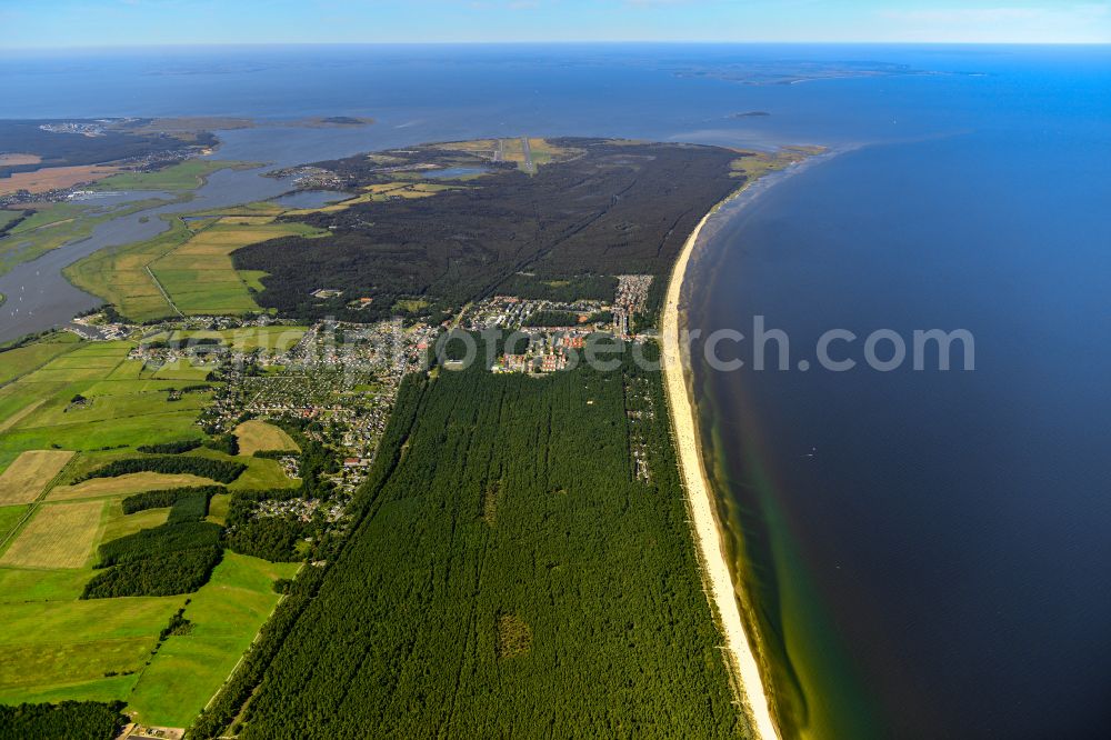 Aerial image Karlshagen - Dunes and camping near the beach in a pine forest in Karl Hagen, a popular tourist and resort on the Baltic Sea coast of the island of Usedom in Mecklenburg-Western Pomerania