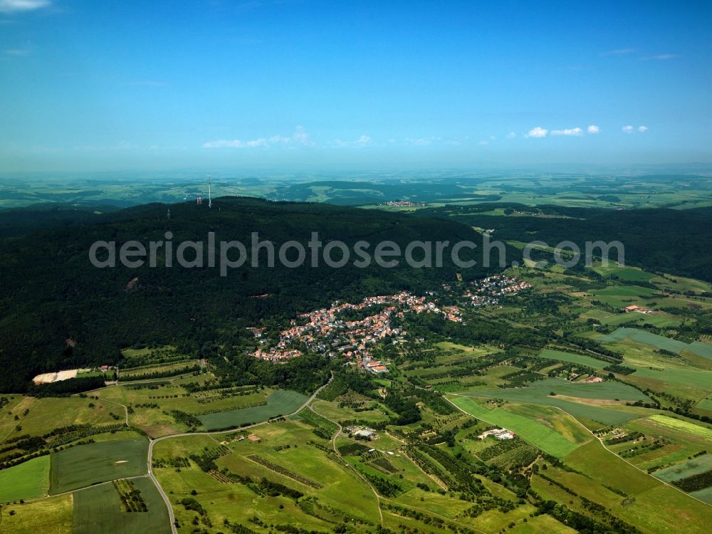 Aerial image Dannenfels - Mount Donnersberg and view of the village of Dannenfels in the state of Rhineland-Palatinate. The mountain is the largest mountain range of the Palatinate area. The mountain rises from the agricultural region is the location of the broadcasting and telecommunications tower Donnersberg and a former U.S. radio station