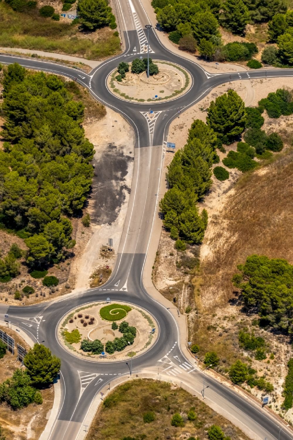 Calvia from above - Traffic management of the double roundabout road auf of Carrer of Capdella in Calvia in Balearische Insel Mallorca, Spain